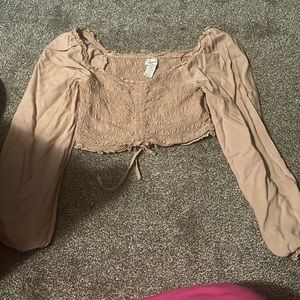 Never worn. Beige crop top size medium. Ties and scrunches at bottom.